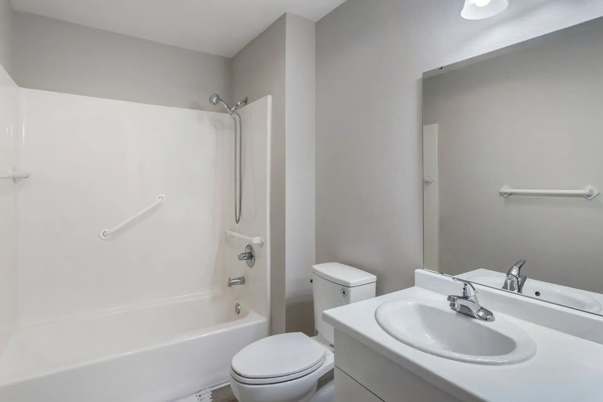 Shower and bathroom with safety handles.